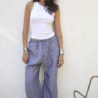 Unisex wide-leg trousers crafted in soft linen with side pockets.